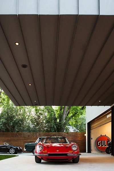 Autohaus is an unconventional residence in Austin, Texas designed by Matt Fajkus Architecture to showcase the owners’ car collection