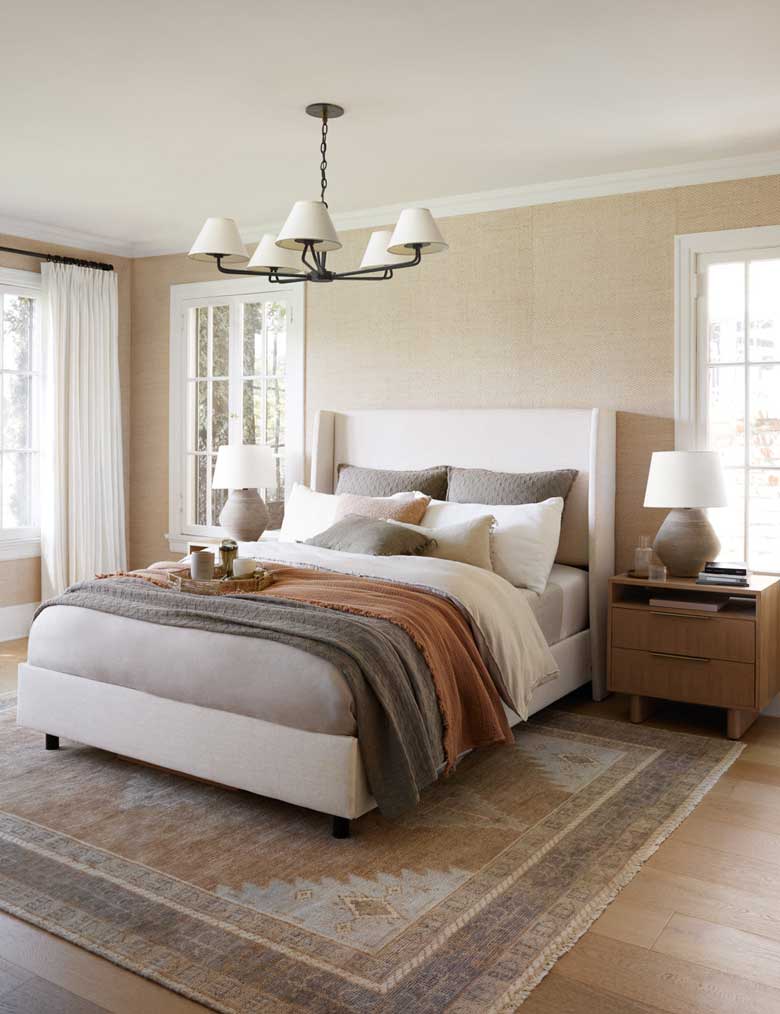 Modern bed with winged headboard and trim lines