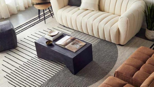 Featuring a monochromatic black, off-white, and medium gray color palette, this modern area rug is perfect for any living room.