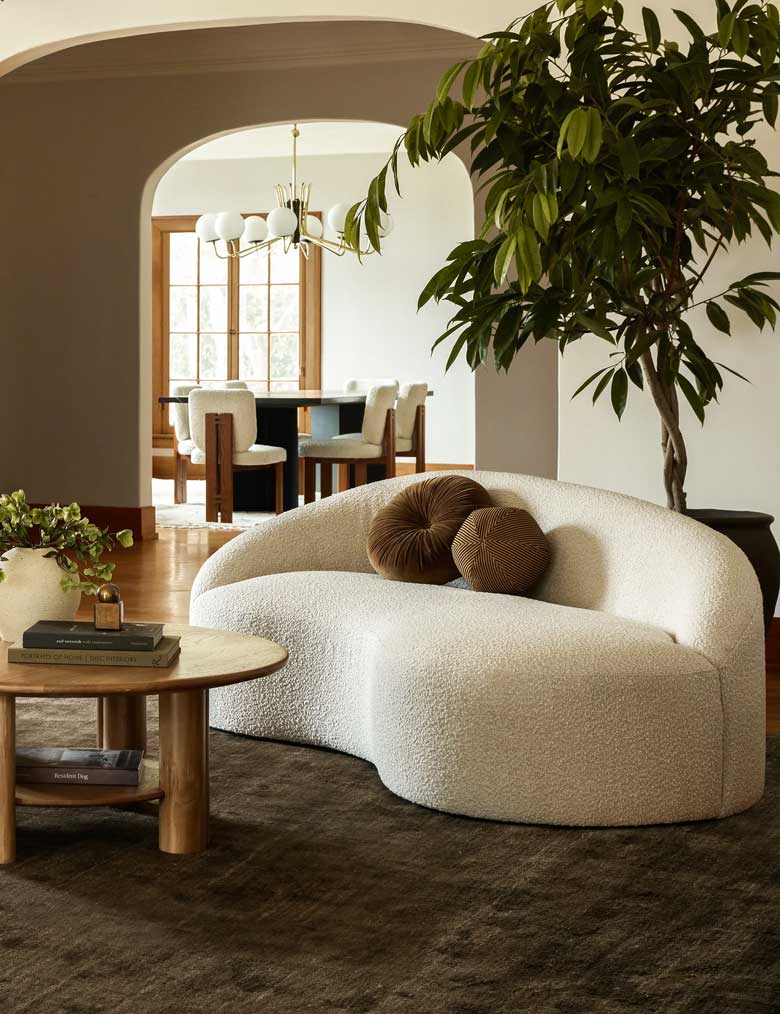 Cozy modern boucle curved sofa perfect for a stylish living area or home office