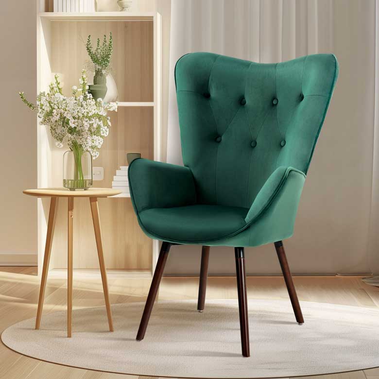 Green velvet wingback chair