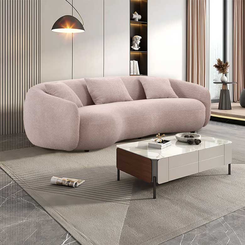 Pink curved sofa perfect for a feminine house or apartment