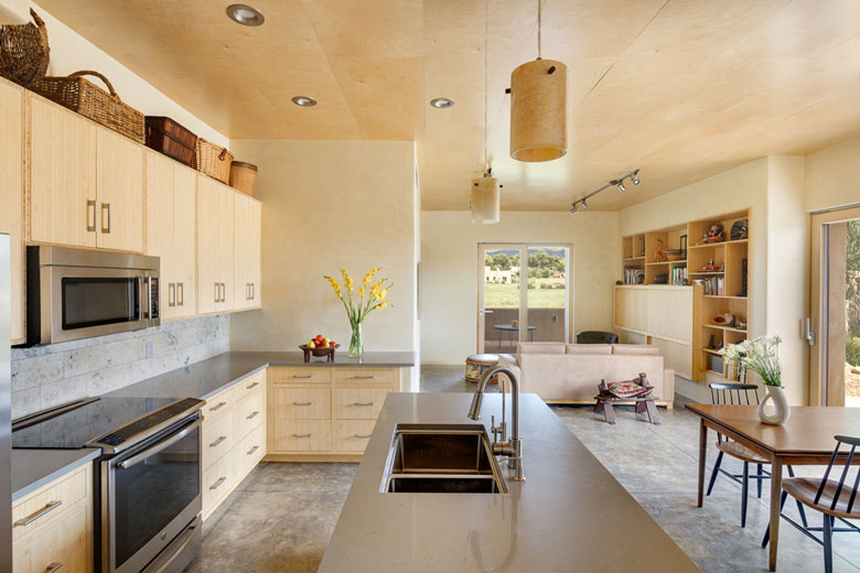 Decorative woven rattan baskets above kitchen cabinets