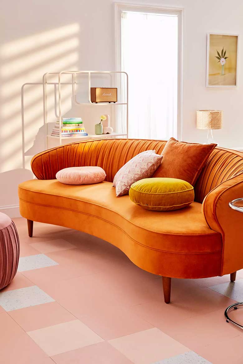 Rust curved velvet sofa